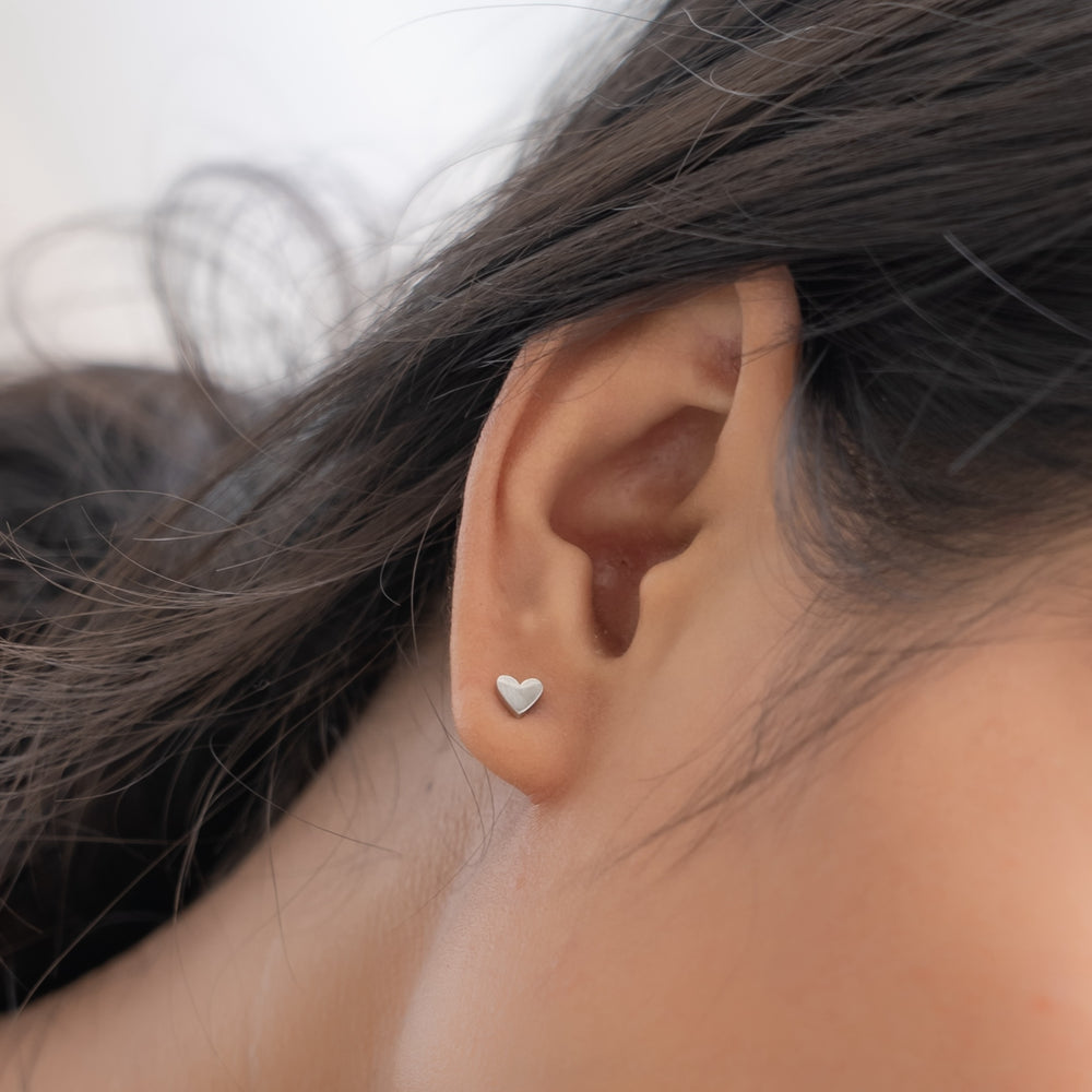 Committed heart stud earrings