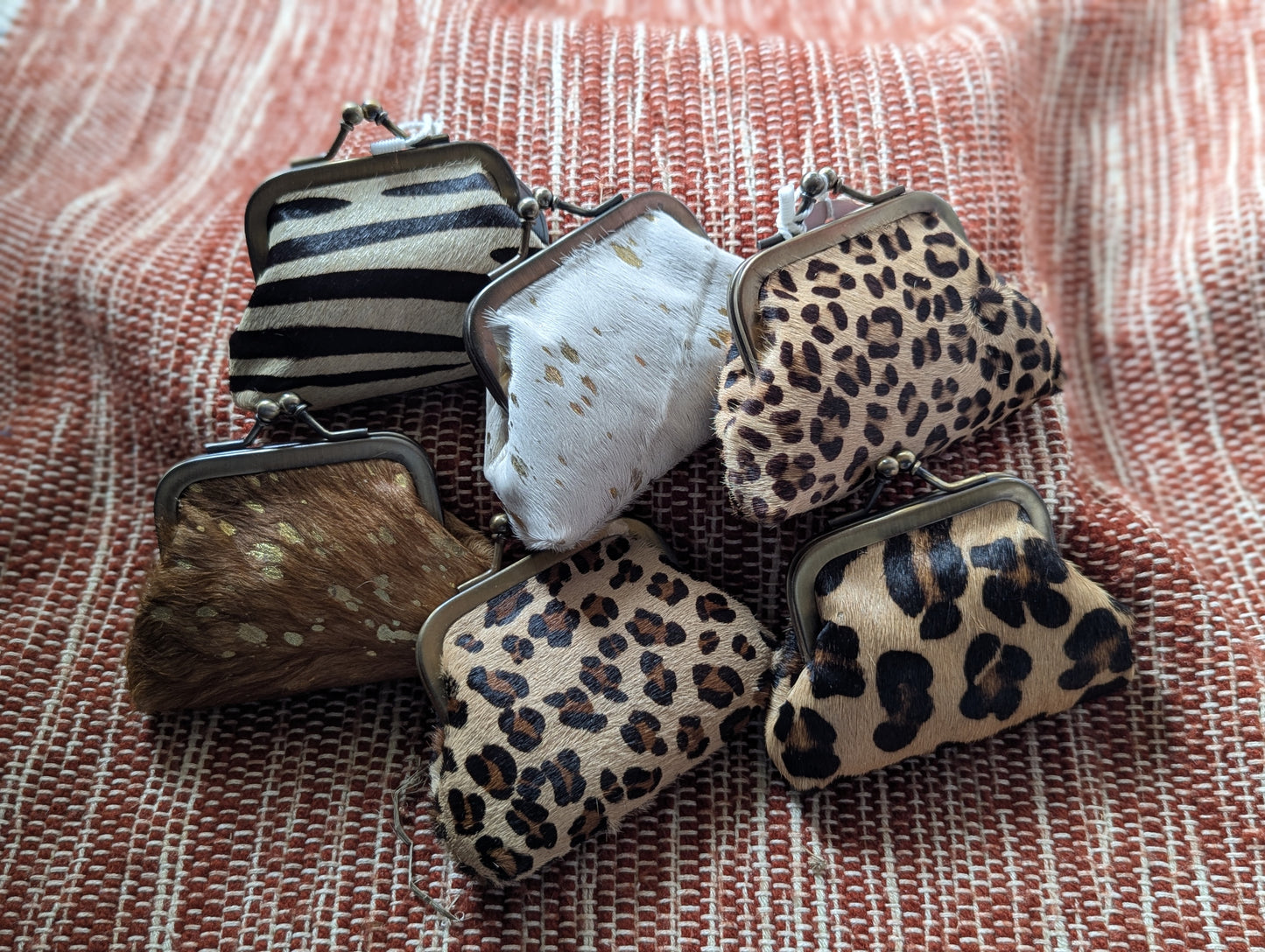 Ethically sourced animal hide kisslock coin purse